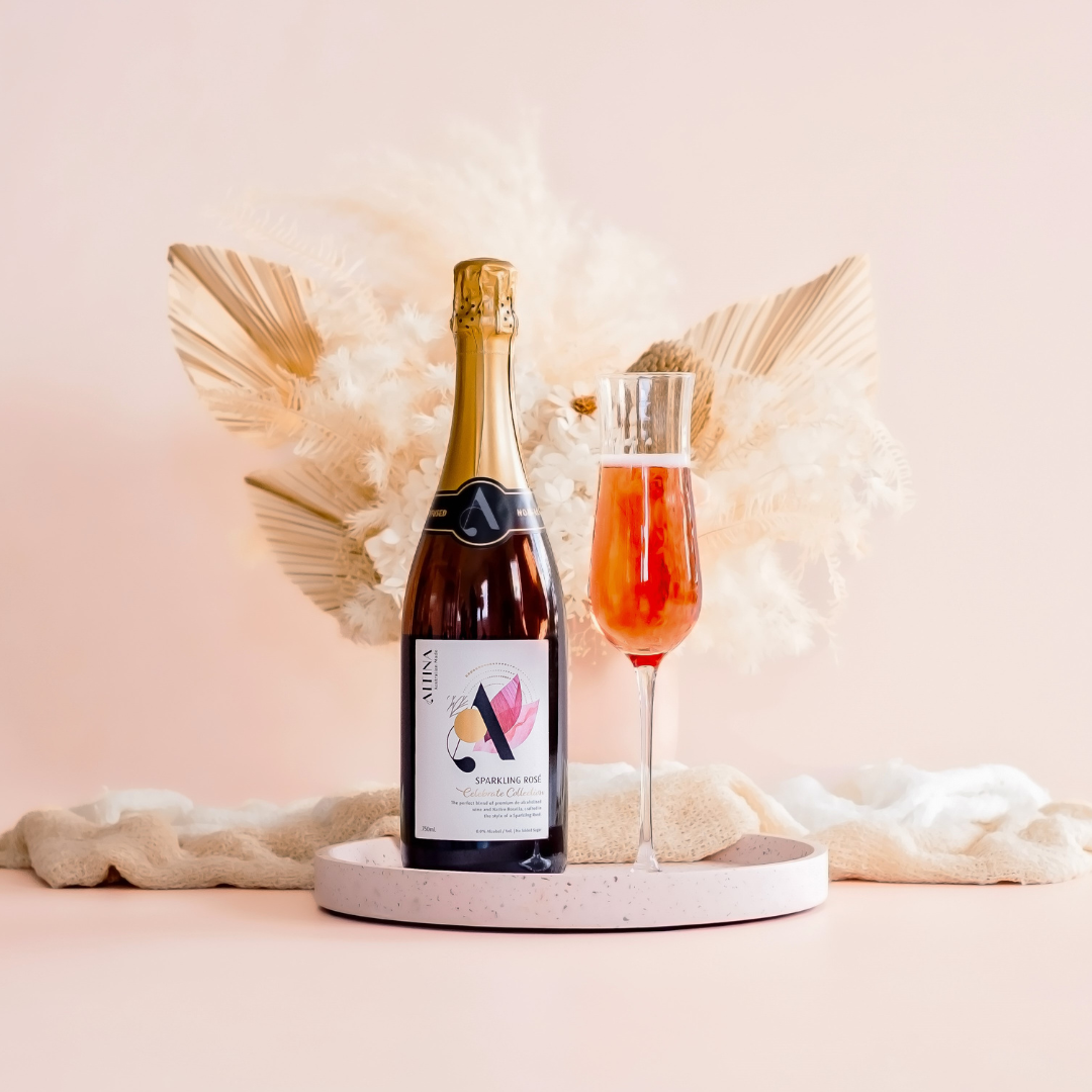 ALTINA Sparkling Rosé - Capturing the beauty of ALTINA’s elegant sparkling rosé wine, complemented by a filled glass showcasing the effervescence pink hue of the sparkling rosé wine. A delightful choice for celebrations, baby showers and hens parties.